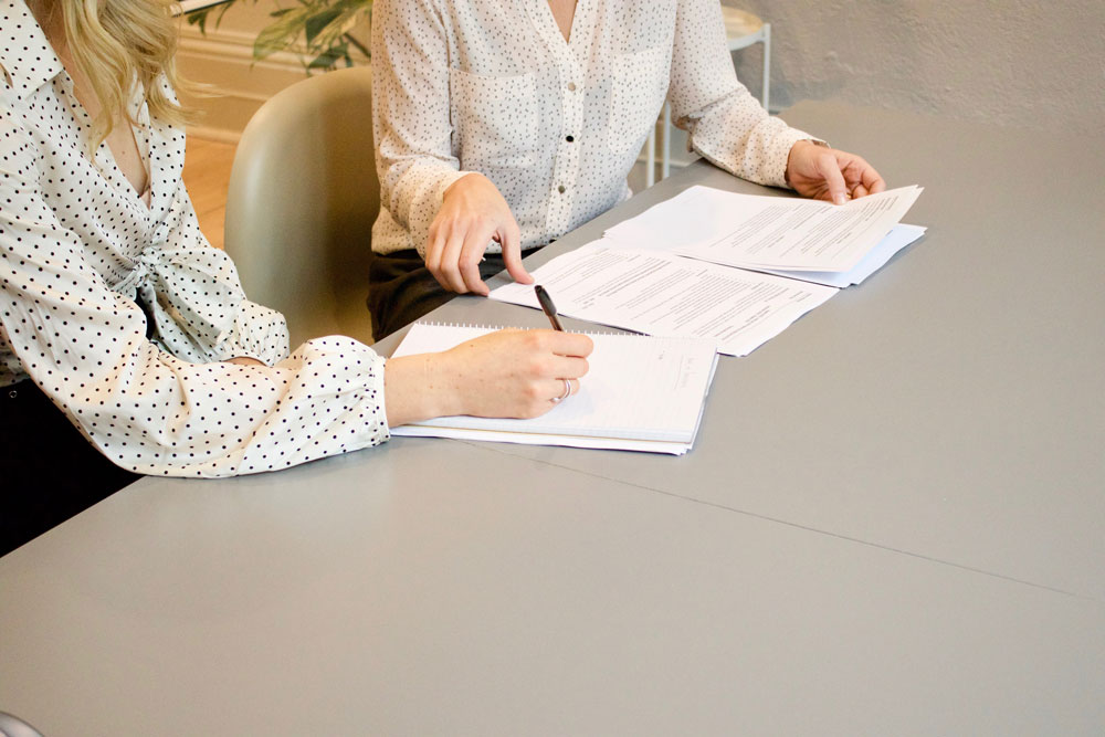 mariahands meeting with client to prepare taxes